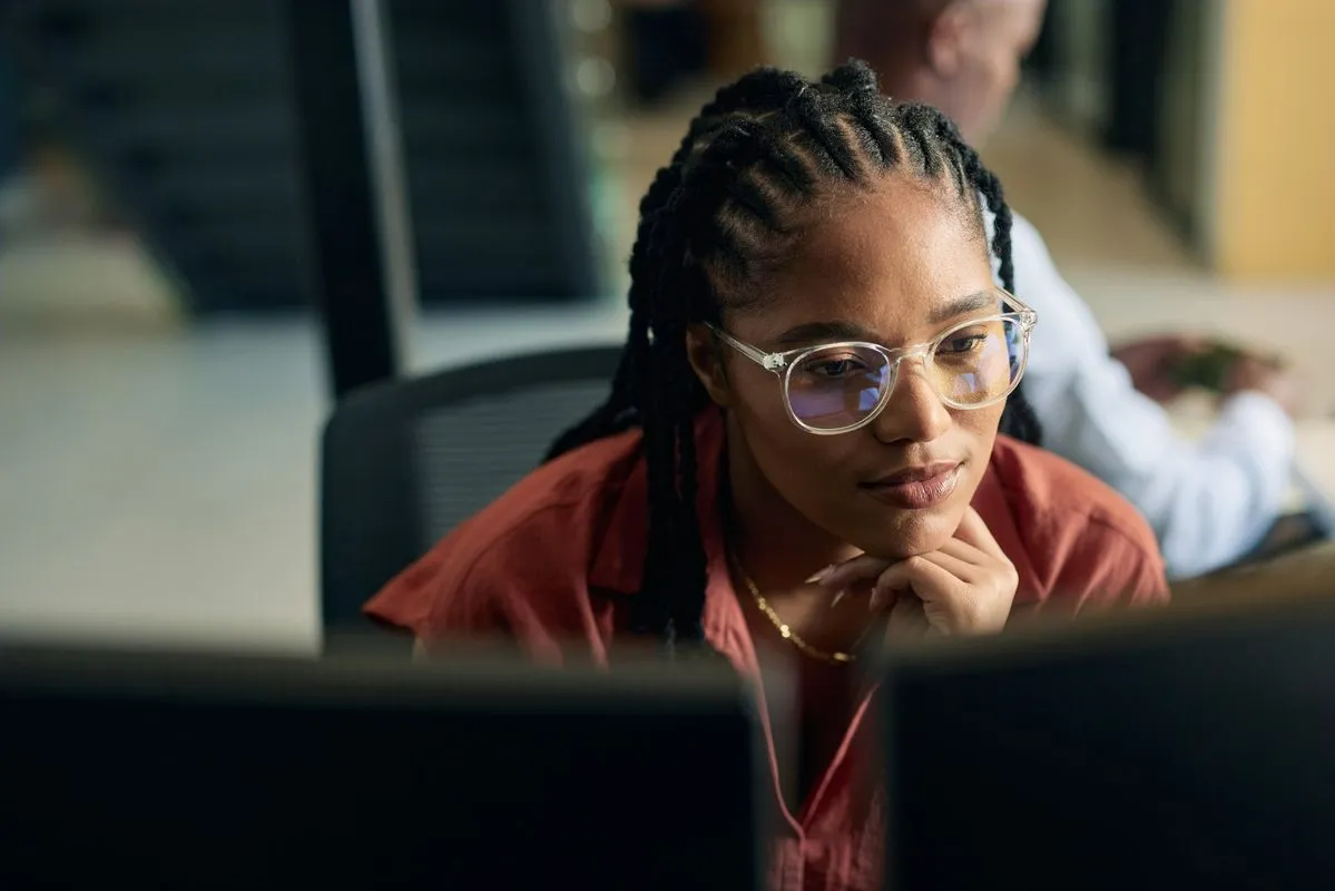 A person browsing a calm, clutter-free webpage on a laptop